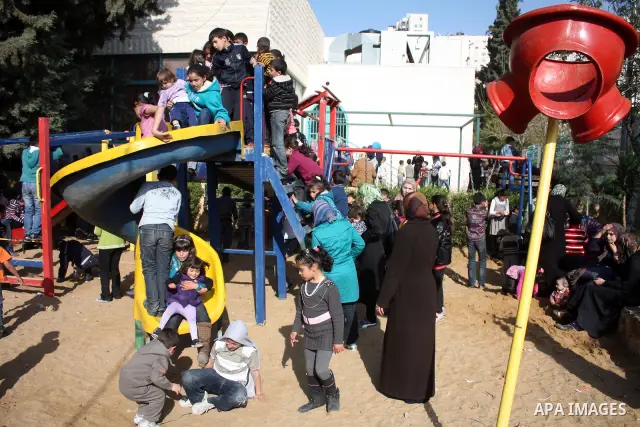 Palestinian children take part in playing festival ( All Together with Children) at Child Happiness Center in the West Bank city of Hebron,on April 07, 2011.Photo by Najeh Hashlamoun