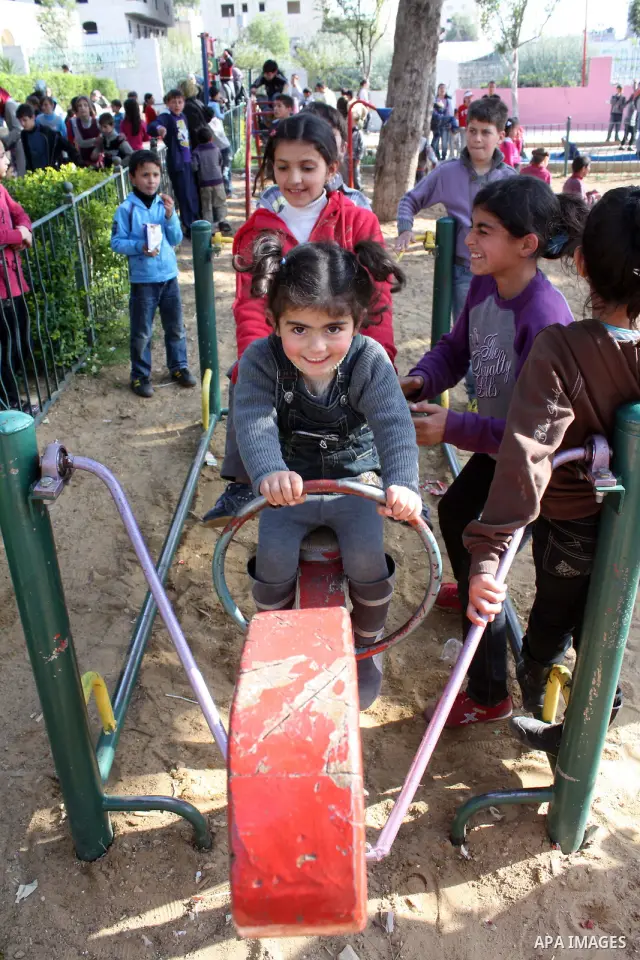 Palestinian children take part in playing festival ( All Together with Children) at Child Happiness Center in the West Bank city of Hebron,on April 07, 2011.Photo by Najeh Hashlamoun