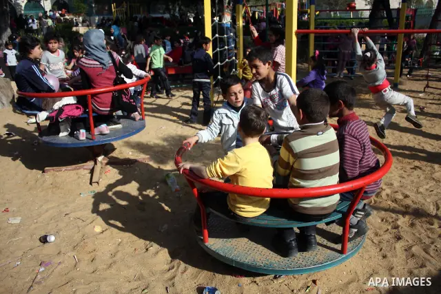 Palestinian children take part in playing festival ( All Together with Children) at Child Happiness Center in the West Bank city of Hebron,on April 07, 2011.Photo by Najeh Hashlamoun