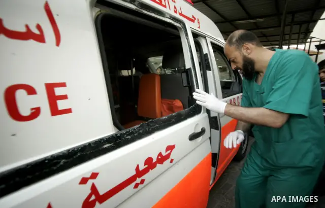 A wounded Palestinian is wheeled at al-Najar hospital in the southern Gaza Strip town of Rafah on April 7, 2011 after Israeli troops shelled two separate areas in Gaza, killing one person and wounded at least 10. Photo b...