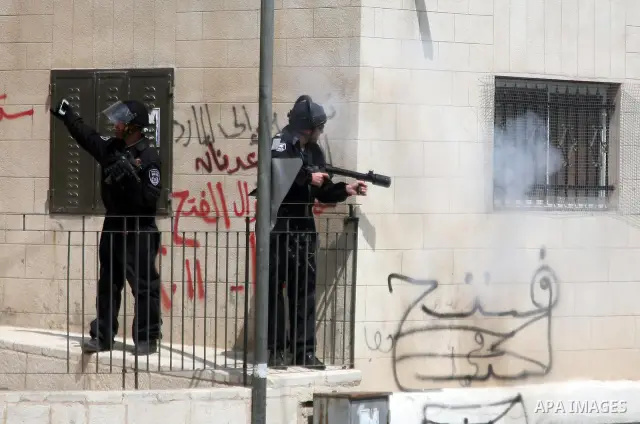 Israeli soldiers fire tear gas canisters towards Palestinian demonstrators during the clashes after Friday prayers in Jerusalem's neighbourhood of Silwan on April 08, 2011. Photo by Sliman Khader