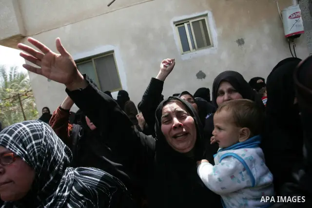 Palestinian women react during the funeral of Hamas militant Abdallah Al Qarra in Khan Younis, southern Gaza Strip, Friday, April 8, 2011. Israeli aircraft and ground forces struck Gaza on Friday in a surge of deadly fig...