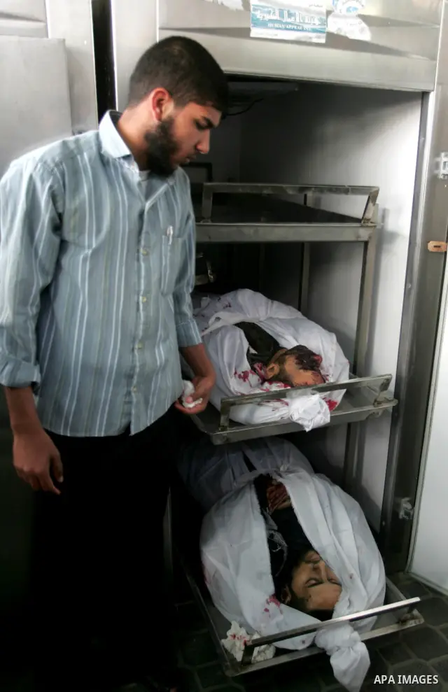 Palestinians carry the body of Hamas militant Abdallah Al Qarra during his funeral in Khan Younis, southern Gaza Strip, Friday, April 8, 2011. Israeli aircraft and ground forces struck Gaza on Friday in a surge of deadly...