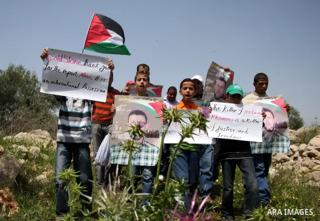 Palestinian protestors take part in the weekly demonstration against Israel's separation barrier in the West Bank village of Nilin, near Ramallah, Friday, April 8, 2011. Israel says the barrier is necessary for security...
