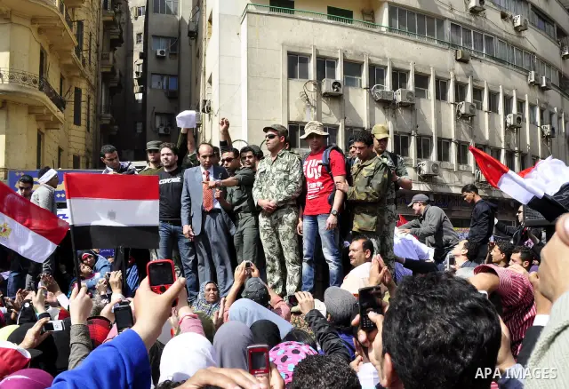Egyptian officers take part in a protest calling the Field Marshal Hussein Tantawi to step down in Cairo's central Tahrir Square, the focal point of Egyptian uprising, during a protest demanding prosecution of Mubarak an...