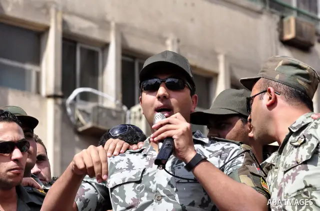 Egyptian officers take part in a protest calling the Field Marshal Hussein Tantawi to step down in Cairo's central Tahrir Square, the focal point of Egyptian uprising, during a protest demanding prosecution of Mubarak an...