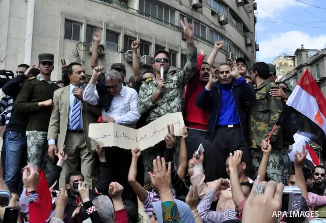 Egyptian officers take part in a protest calling the Field Marshal Hussein Tantawi to step down in Cairo's central Tahrir Square, the focal point of Egyptian uprising, during a protest demanding prosecution of Mubarak an...