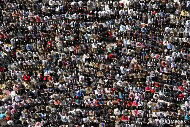 Egyptians perform Friday prayers as tens of thousands gathered for a demonstration at Cairo's Tahrir Square on April 8, 2011, two months after president Hosni Mubarak was ousted, to demand that former regime officials in...