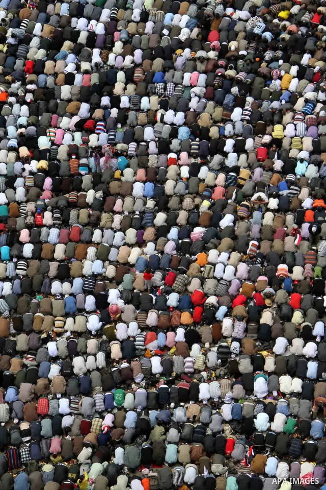 Egyptians perform Friday prayers as tens of thousands gathered for a demonstration at Cairo's Tahrir Square on April 8, 2011, two months after president Hosni Mubarak was ousted, to demand that former regime officials in...