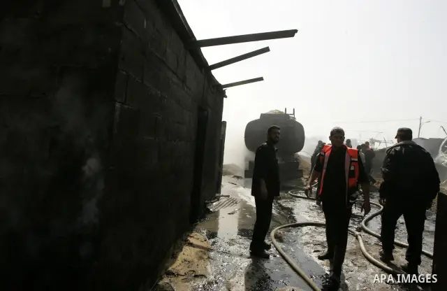 Palestinians try to extinguish an accidental fire that swept over a smuggling tunnel in the southern Gaza Strip town of Rafah on the border with Egypt on April 8, 2011. Tunnels under the town of Rafah that straddles the...