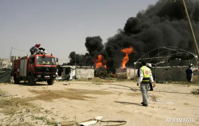 Palestinians try to extinguish an accidental fire that swept over a smuggling tunnel in the southern Gaza Strip town of Rafah on the border with Egypt on April 8, 2011. Tunnels under the town of Rafah that straddles the...