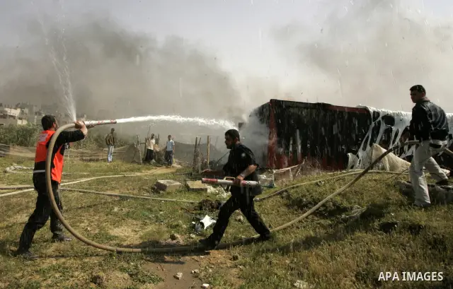 Palestinians try to extinguish an accidental fire that swept over a smuggling tunnel in the southern Gaza Strip town of Rafah on the border with Egypt on April 8, 2011. Tunnels under the town of Rafah that straddles the...
