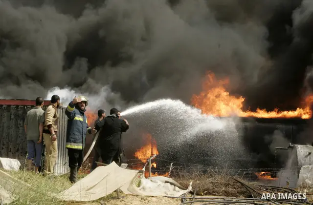 Palestinians try to extinguish an accidental fire that swept over a smuggling tunnel in the southern Gaza Strip town of Rafah on the border with Egypt on April 8, 2011. Tunnels under the town of Rafah that straddles the...