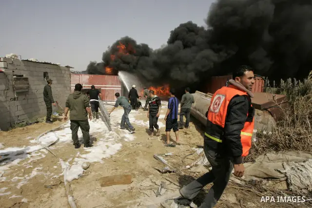Palestinians try to extinguish an accidental fire that swept over a smuggling tunnel in the southern Gaza Strip town of Rafah on the border with Egypt on April 8, 2011. Tunnels under the town of Rafah that straddles the...