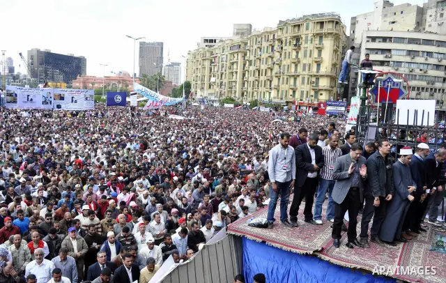 Egyptians perform Friday prayers as tens of thousands gathered for a demonstration at Cairo's Tahrir Square on April 8, 2011, two months after president Hosni Mubarak was ousted, to demand that former regime officials in...