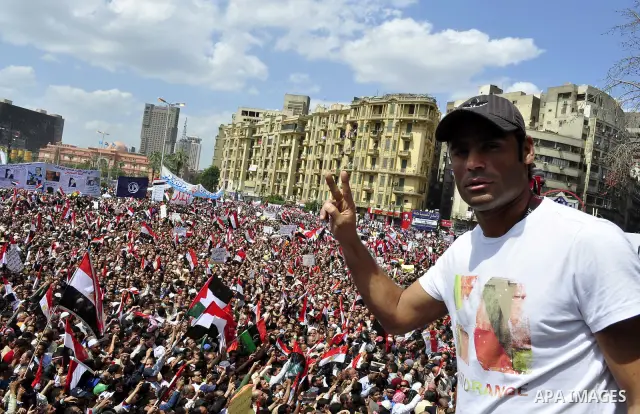 Egyptians hold flags and shout slogans as tens of thousands gathered for a demonstration at Cairo's Tahrir Square on April 8, 2011, two months after president Hosni Mubarak was ousted, to demand that former regime offici...