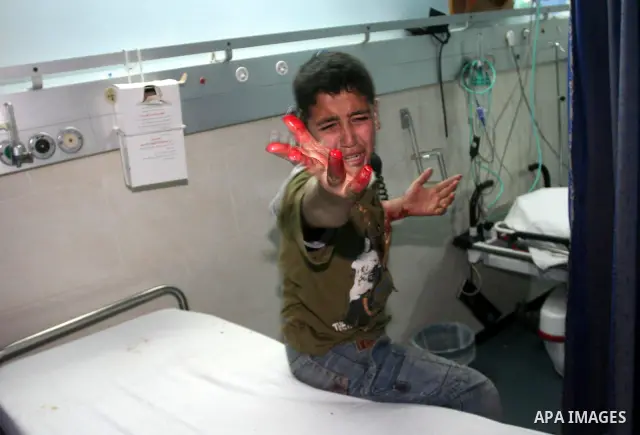 A wounded Palestinian boy cries as he waits for treatment at a hospital in Gaza City on April 8, 2011 following Israeli shelling in which two Palestinians were killed and 10 people wounded, including some children. Photo...