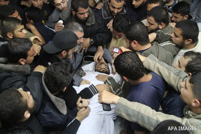 Palestinians carry the body of Hamas militant Rayed Shehada during his funeral in Shati refugee camp in Gaza City on 08 April 2011 The air raids came a day after Gaza-based militants fired an attack-tank shell at an Isra...