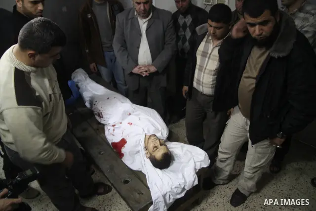 The body of a killed Palestinian Mohamed El-Araer, in a hospital mortuary after an Israeli airstrike in Gaza City on 08 April 2011 The air raids came a day after Gaza-based militants fired an attack-tank shell at an Isra...