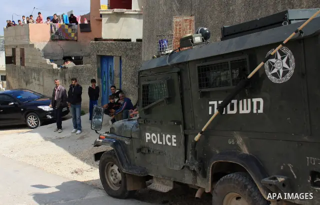 Israeli troops arrive to break up a scuffle between Jewish settlers and Palestinians in the West Bank village of Aseera, Saturday, April 9, 2011. Palestinian witnesses said about 40 settlers entered the village and scuff...