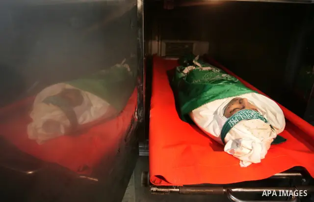 The body of Palestinian boy Mahmud al-Jaro lies at the mortuary of a hospital before his funeral in Gaza City on April 9, 2011. Militant group Hamas said on Saturday it would escalate it attacks against Israel to include...