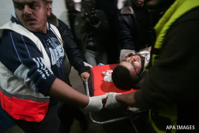 Palestinians transport an injured man to Al-Shifa hospital after an Israeli air strike in Gaza City April 9, 2011. Israel killed four Palestinian militants and wounded half a dozen others as it pursued air raids in Gaza...