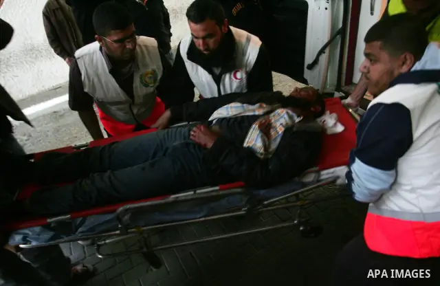 Palestinians transport an injured man to Al-Shifa hospital after an Israeli air strike in Gaza City April 9, 2011. Israel killed four Palestinian militants and wounded half a dozen others as it pursued air raids in Gaza...