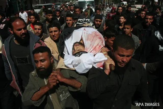 Palestinians carry the body of Popular Resistance Committees militant Raed Al-Bar during his funeral in Gaza City April 10, 2011. Al-Bar was killed in an Israeli air strike on Saturday. Palestinian militant groups in the...