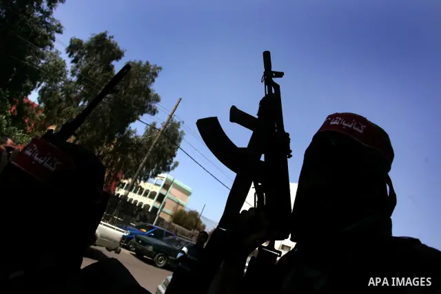Palestinian militants of the National Resistance Brigades, the military wing of the Democratic Front for the Liberation of Palestine (DFLP), attend a news conference in the central Gaza City, 10 April 2011. Israel will c...