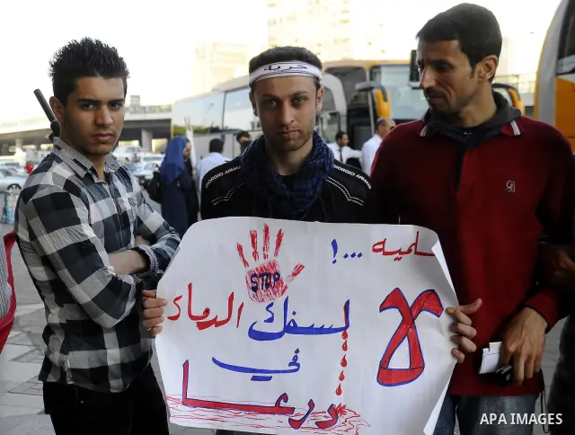 Syrians living in Egypt demonstrate against the recent actions of the Syrian government and in support of protesters at Tahrir Square, Cairo, Egypt on April 10,2011. Syrian security forces opened fire in the coastal town...