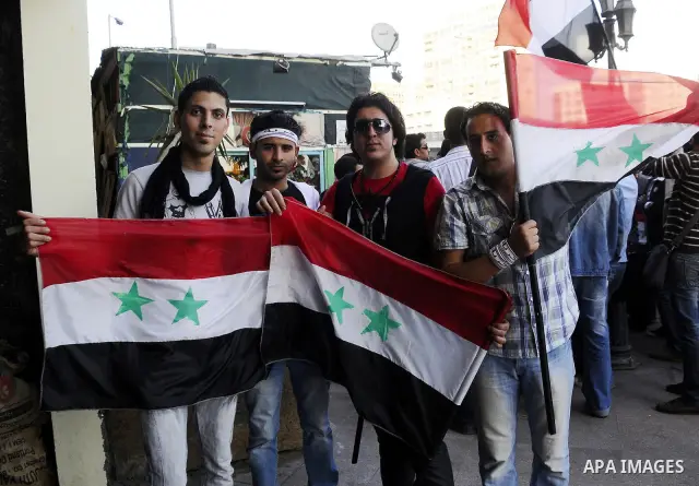 Syrians living in Egypt demonstrate against the recent actions of the Syrian government and in support of protesters at Tahrir Square, Cairo, Egypt on April 10,2011. Syrian security forces opened fire in the coastal town...