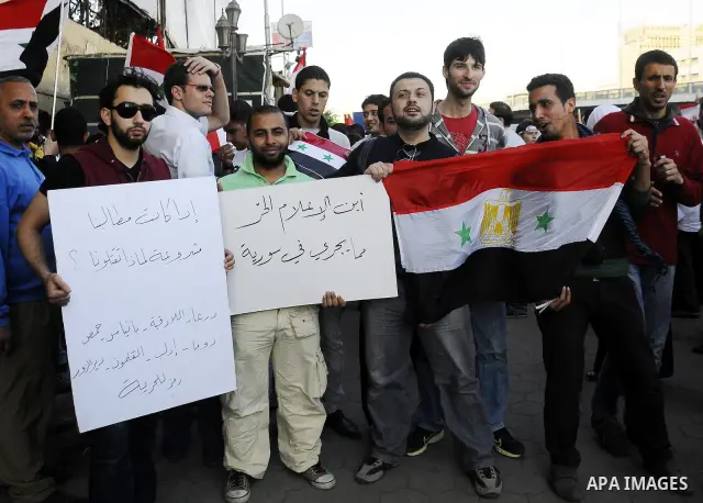 Syrians living in Egypt demonstrate against the recent actions of the Syrian government and in support of protesters at Tahrir Square, Cairo, Egypt on April 10,2011. Syrian security forces opened fire in the coastal town...