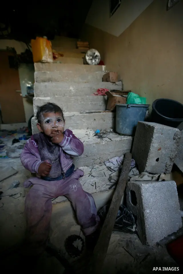 Palestinians inspect damage in their house in the West Bank village of Awarta near Nablus April 11, 2011, which they say was caused by an Israeli army raid. The Israeli army often carries out raids in West Bank towns and...