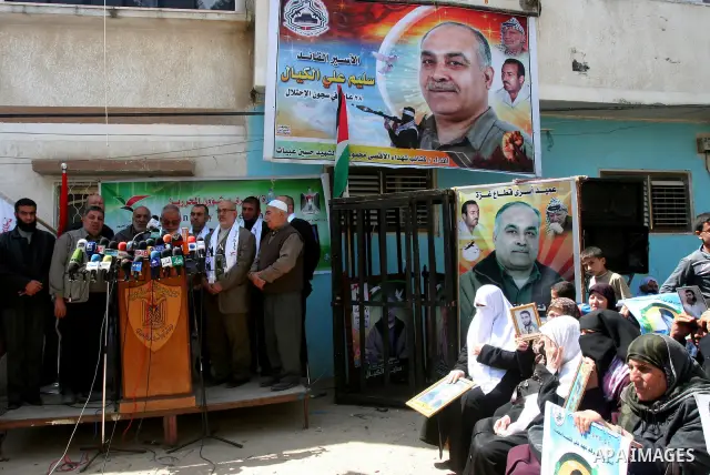 Palestinian of jailed relatives take part in a protest in front of the oldest Gazan prisoner's house Salim al-Keali to mark the Prisoner Day in Gaza city on April 11, 2011. Photo by Mohamad Asad