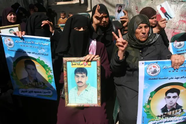 Palestinian of jailed relatives take part in a protest in front of the oldest Gazan prisoner's house Salim al-Keali to mark the Prisoner Day in Gaza city on April 11, 2011. Photo by Mohamad Asad