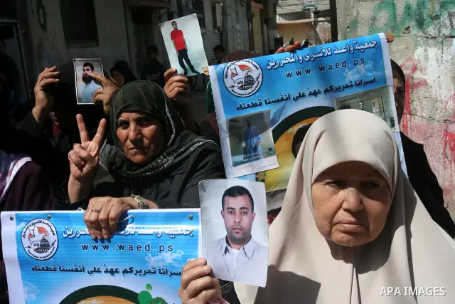 Palestinian of jailed relatives take part in a protest in front of the oldest Gazan prisoner's house Salim al-Keali to mark the Prisoner Day in Gaza city on April 11, 2011. Photo by Mohamad Asad