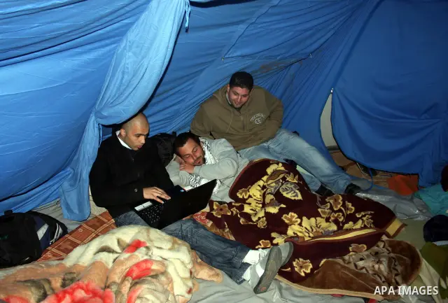 Palestinians sit in a tent as they protest in the West Bank city of Ramallah in support of hunger strikers calling for national unity and who have been on strike for the past nineteen days, on April 12, 2011. Photo by Is...