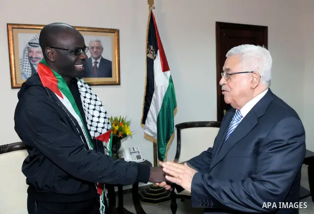 Palestinian President Mahmoud Abbas meets the Former French soccer player Lilian Thuram in the West Bank city of Ramallah April 12, 2011. Photo by Thaer Ganaim