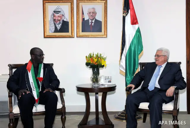 Palestinian President Mahmoud Abbas meets the Former French soccer player Lilian Thuram in the West Bank city of Ramallah April 12, 2011. Photo by Thaer Ganaim