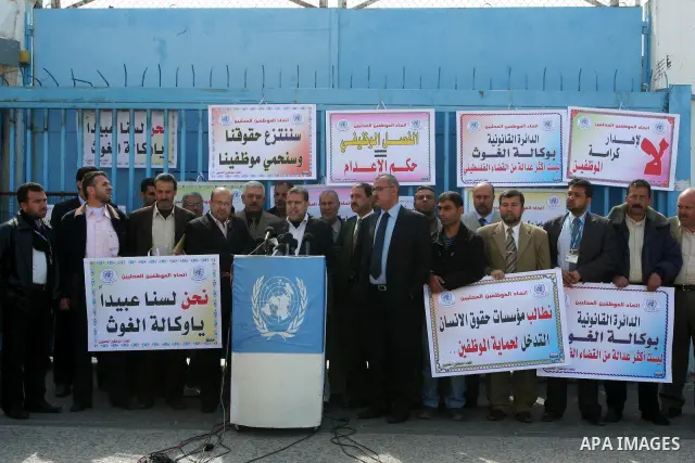 Palestinian UNRWA employees take part in a protest after a work strike extended to three days in Gaza city on April 13,2011 calling the UNRWA to stop the separation of the employees . Photo by Mohammed Asad