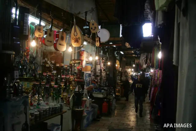 Palestinians shop at the main market in the old city of Jerusalem on April 13, 2011. Photo by Mahfouz Abu Turk