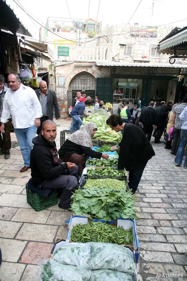 Palestinians shop at the main market in the old city of Jerusalem on April 13, 2011. Photo by Sliman Khader