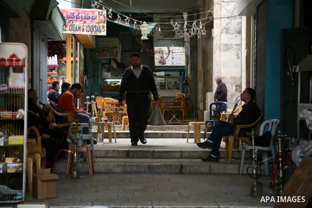 Palestinians shop at the main market in the old city of Jerusalem on April 13, 2011. Photo by Sliman Khader