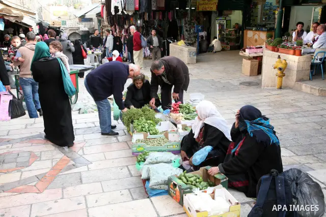 Palestinians shop at the main market in the old city of Jerusalem on April 13, 2011. Photo by Sliman Khader