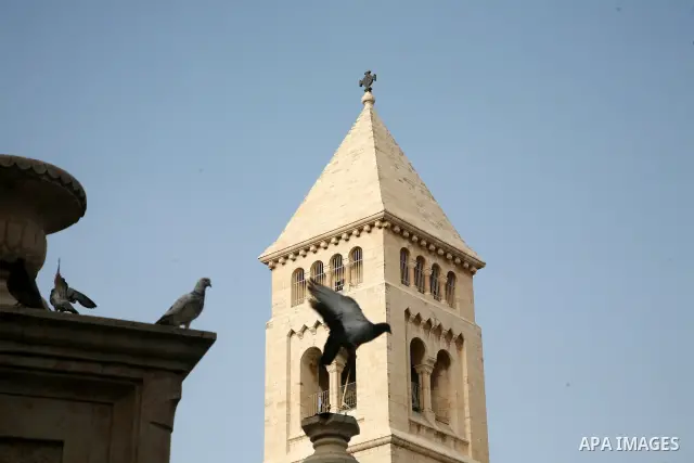 Doves fly over the Church of the Holy Sepulchre (resurrection) in Jerusalem's Old City on April 13, 2011. Photo by Sliman Khader