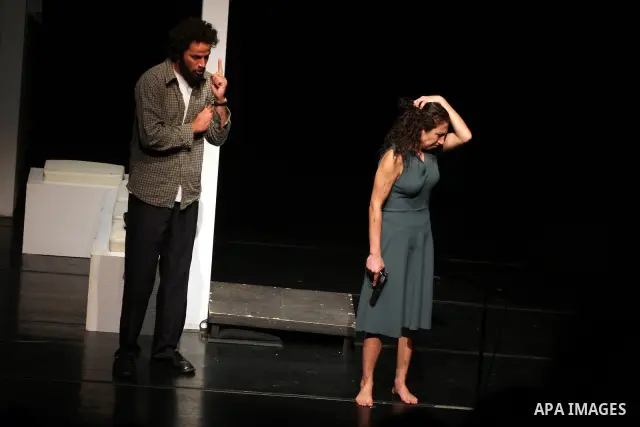 Palestinians perform scenes from the play "The Death of the Virgin" at the conclusion of the Festival "Days of lighthouse" in the West Bank city of Ramallah April 13, 2011. Photo by Issam Rimawi