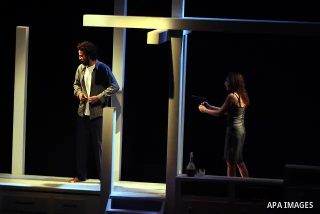 Palestinians perform scenes from the play "The Death of the Virgin" at the conclusion of the Festival "Days of lighthouse" in the West Bank city of Ramallah April 13, 2011. Photo by Issam Rimawi