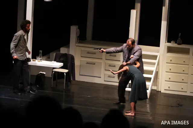 Palestinians perform scenes from the play "The Death of the Virgin" at the conclusion of the Festival "Days of lighthouse" in the West Bank city of Ramallah April 13, 2011. Photo by Issam Rimawi