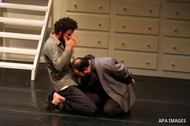 Palestinians perform scenes from the play "The Death of the Virgin" at the conclusion of the Festival "Days of lighthouse" in the West Bank city of Ramallah April 13, 2011. Photo by Issam Rimawi