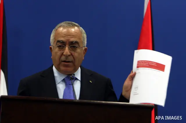 Palestinian Prime Minister Salam Fayyad addressing the media during a press conference at his office in the West Bank town of Ramallah, about the results of the donors meeting held in Brussels, on 14 April 2011, Fayyad m...